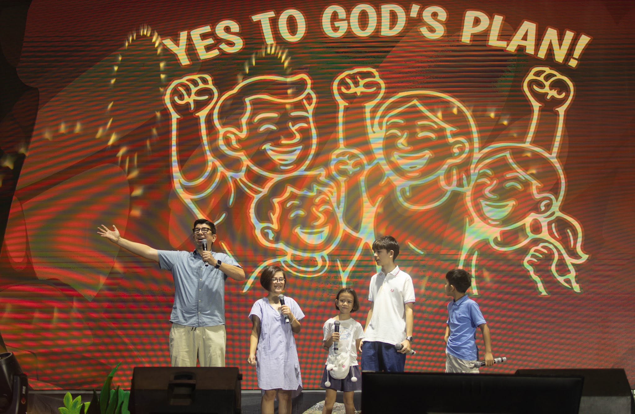 A family smiling together during a fellowship track event